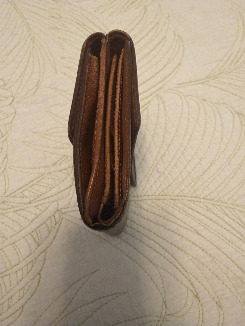 Louis Vuitton trifold snap wallet. Authentication provided.